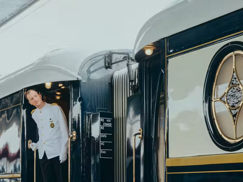 A steward at the door of a Venice Simplon-Orient-Express carriage